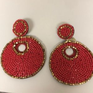 Reddish orange and gold statement earrings